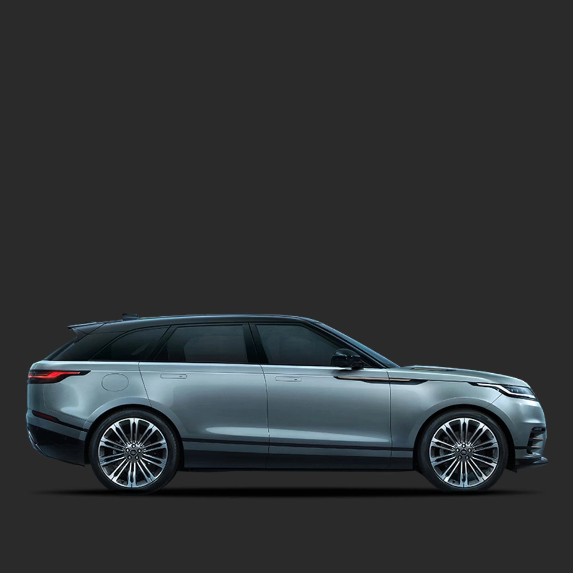 Side view of a silver SUV on a dark gray background
