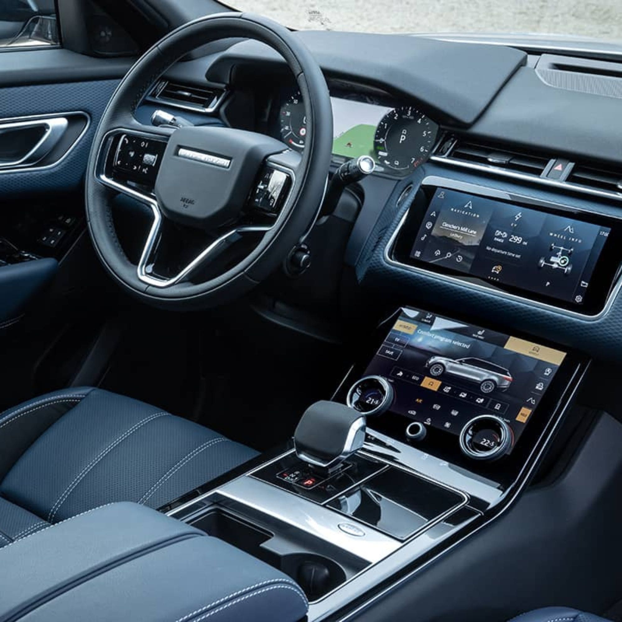 Car interior with steering wheel, dashboard, and center console.