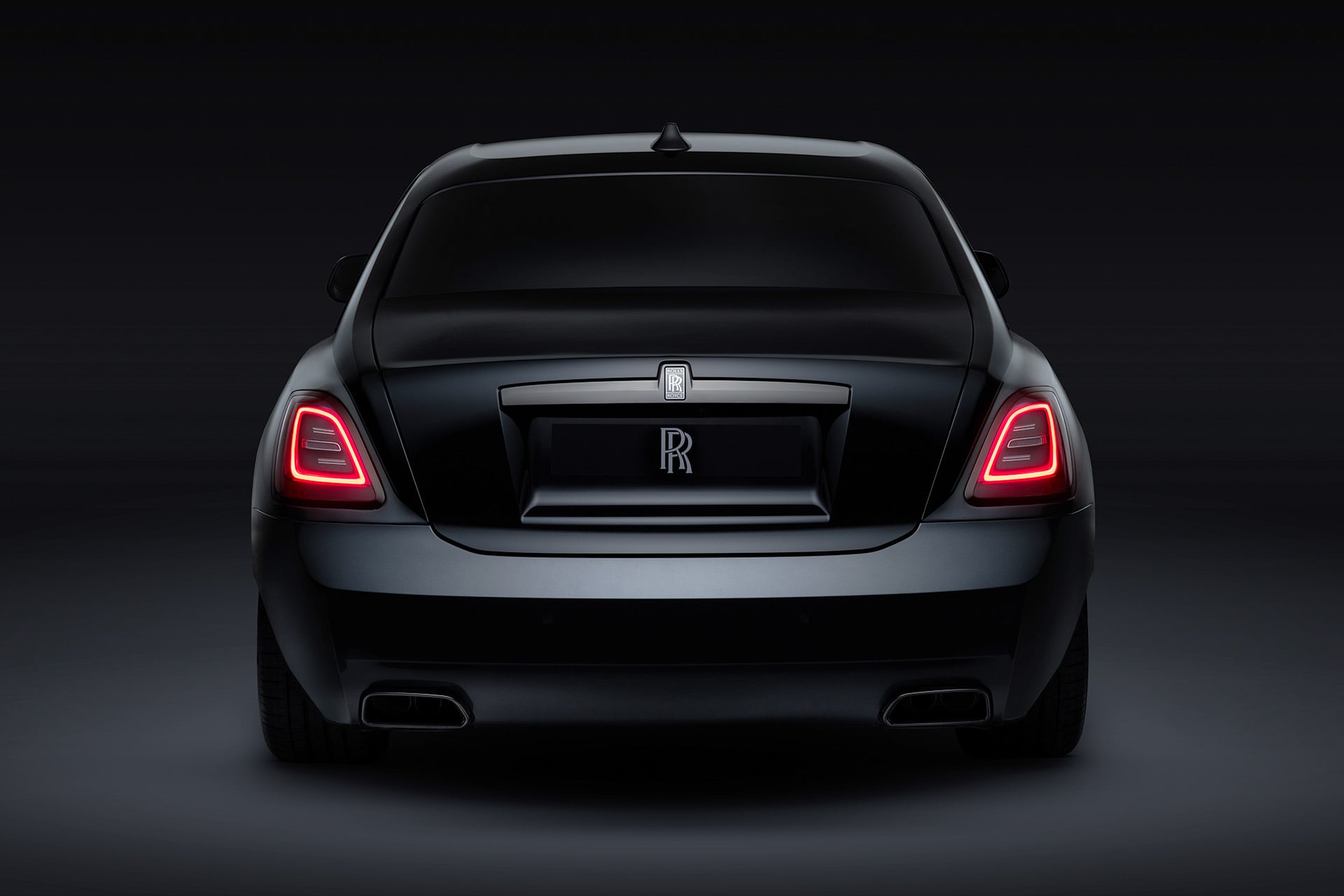 Black Rolls-Royce car on a dark background