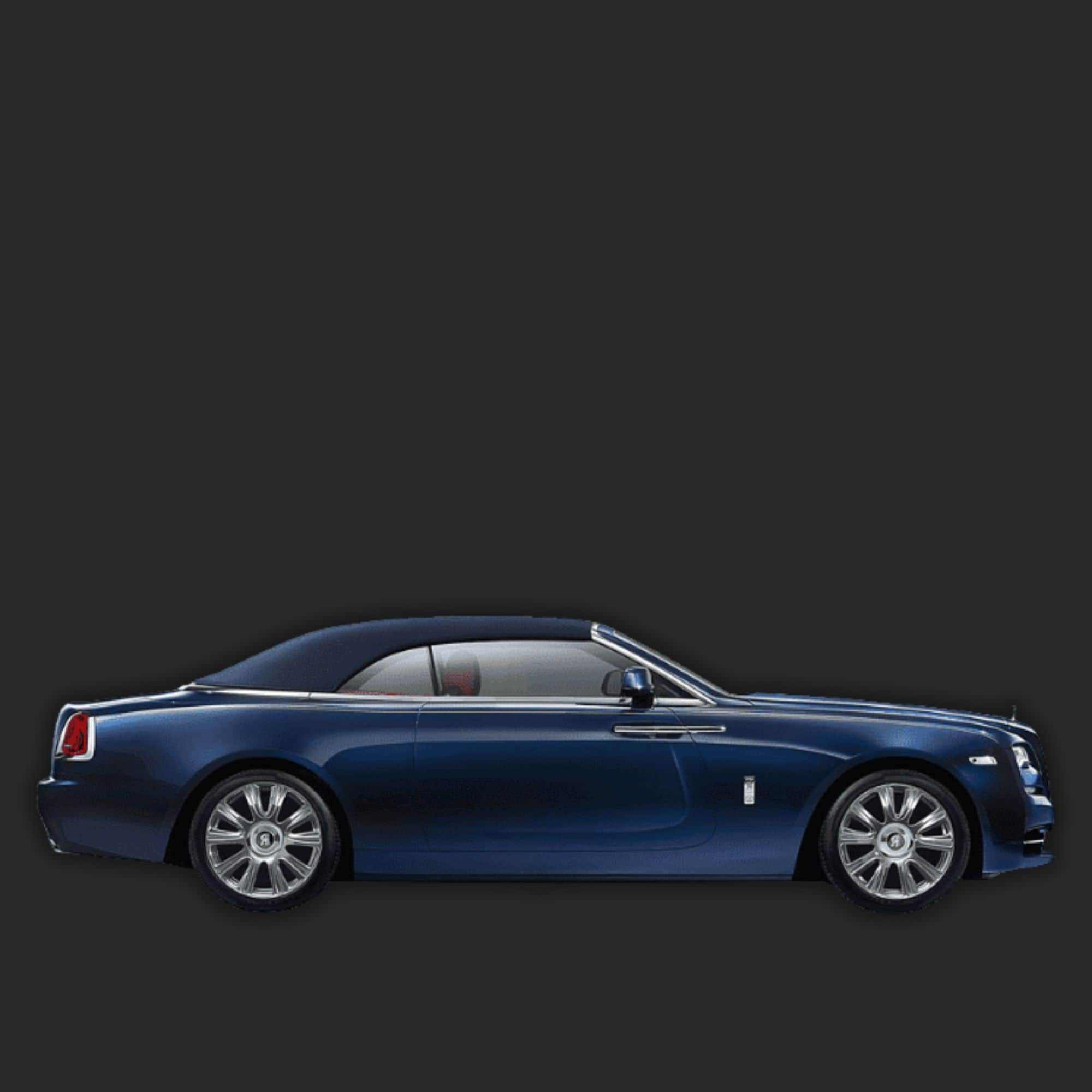 A side profile view of a dark blue Rolls-Royce Dawn convertible car with silver multi-spoke wheels, set against a solid dark gray background.