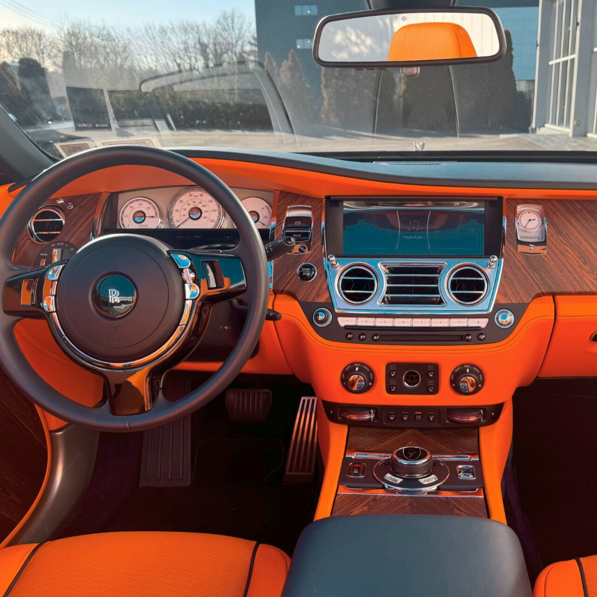 Luxury car interior with orange and black design