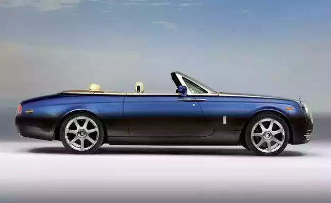 Blue convertible luxury car on a gray background