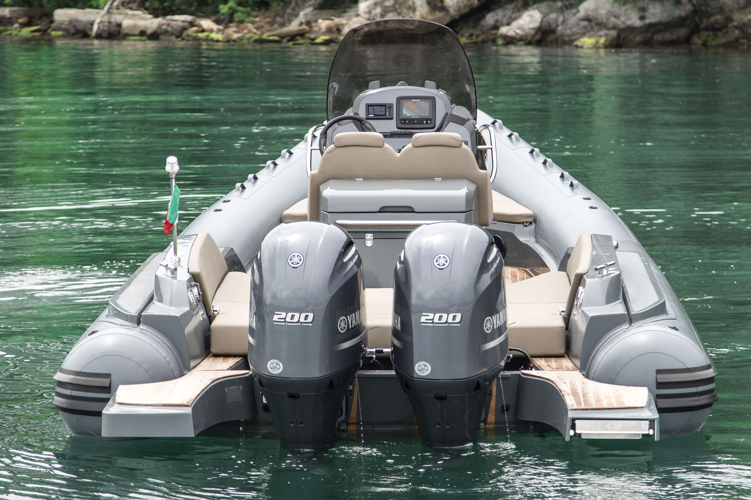 Inflatable boat with Yamaha outboard motors on a body of water