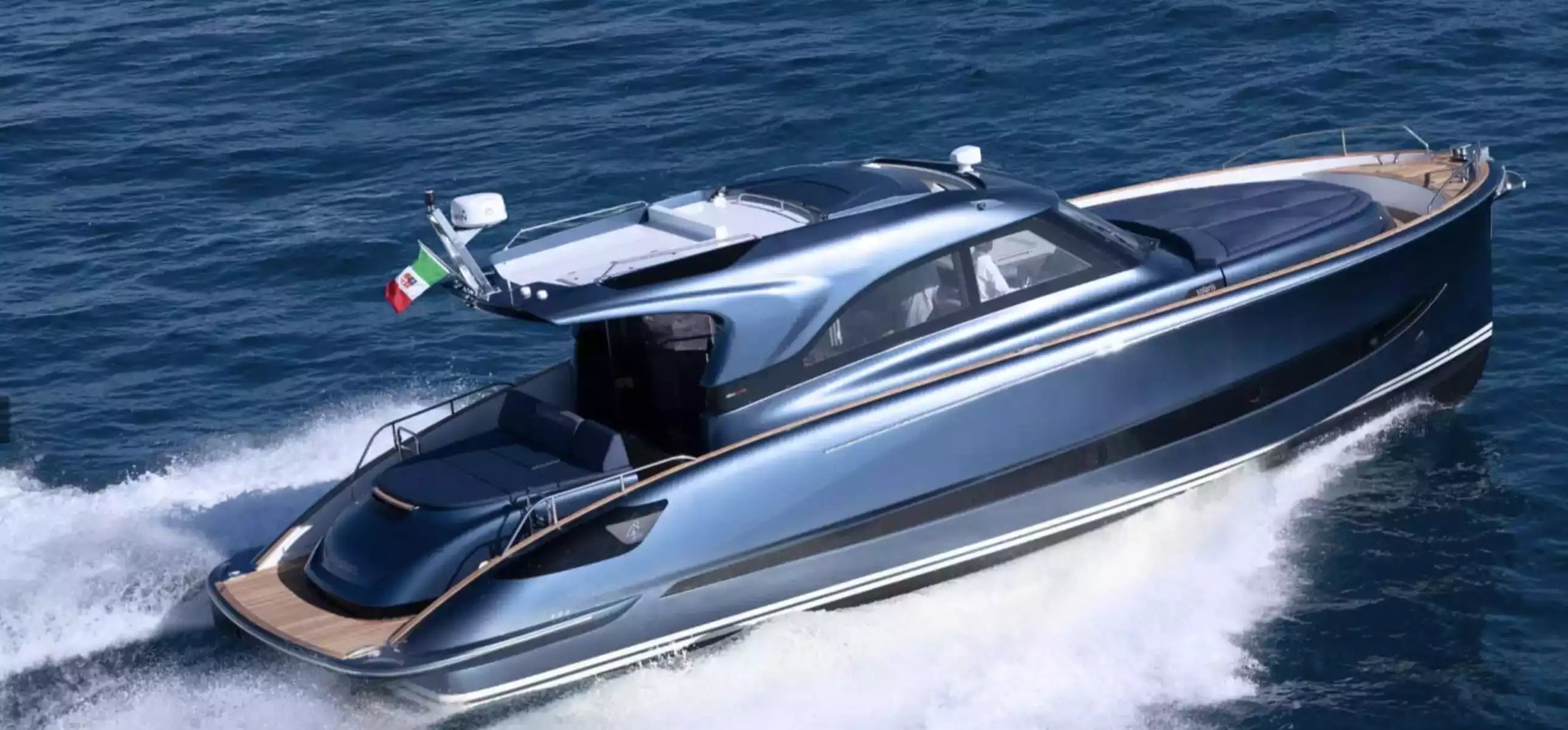Luxury speedboat on the water with an Italian flag