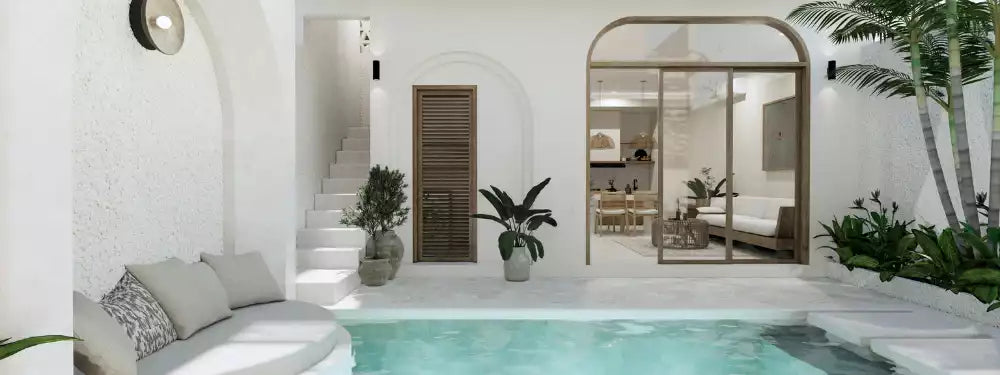 Modern indoor-outdoor living space with a pool, white walls, and decorative plants.