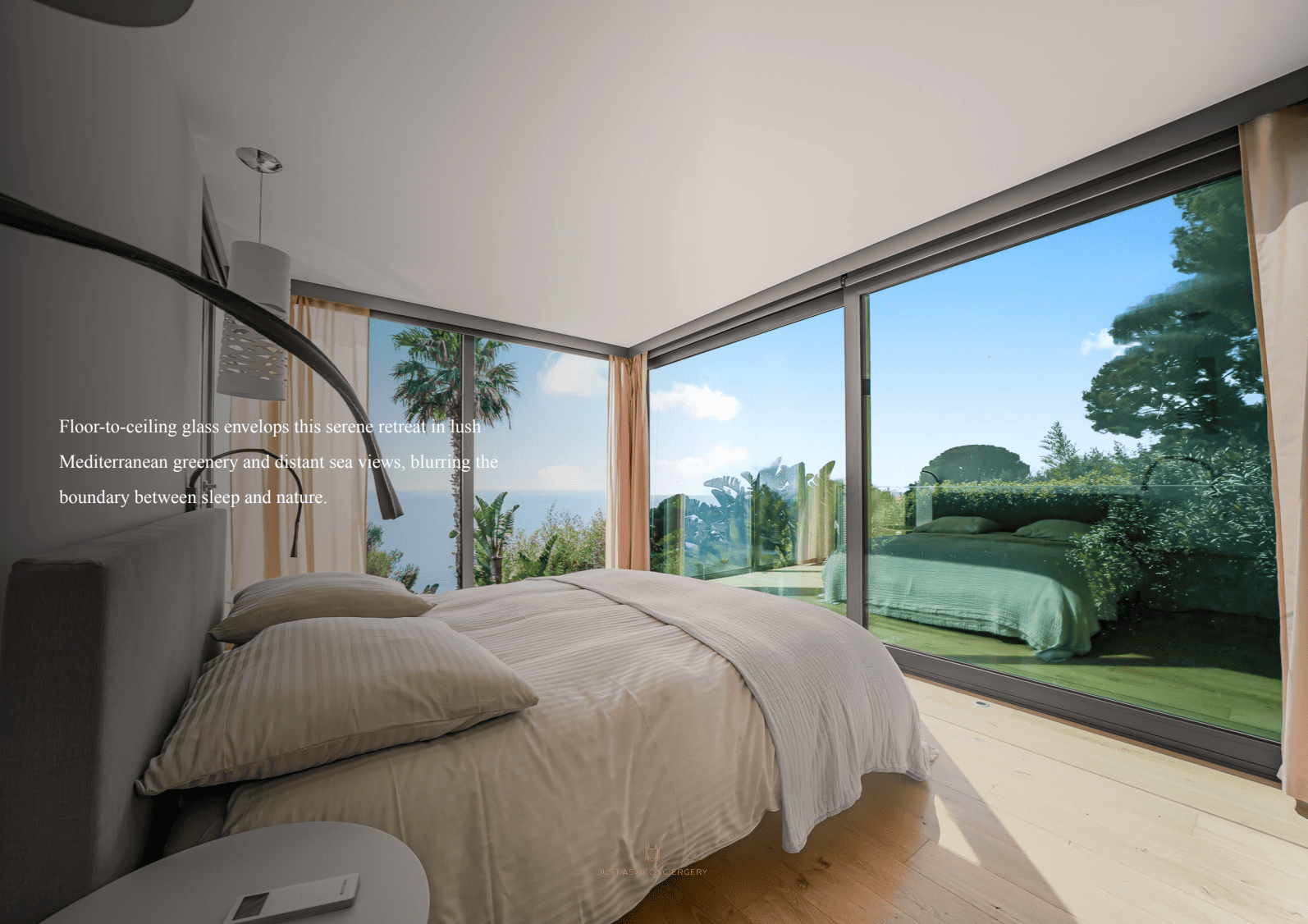 Modern bedroom with floor-to-ceiling glass windows offering a view of a garden.