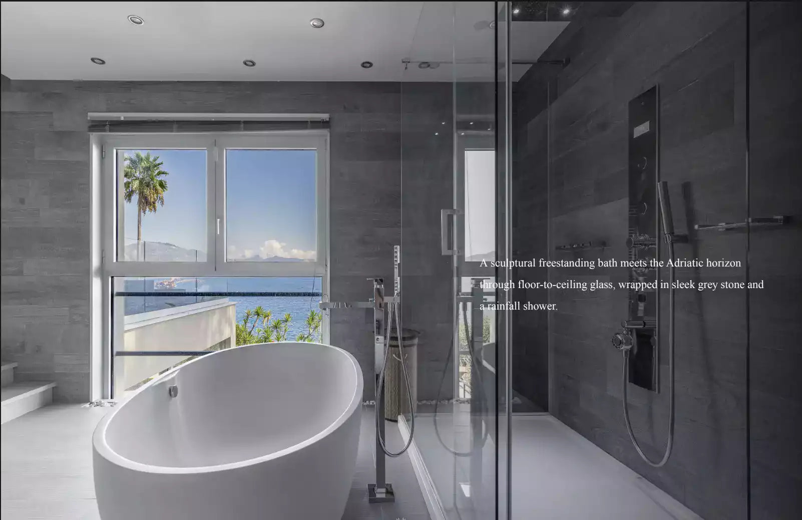 Modern bathroom with a freestanding bathtub and floor-to-ceiling glass wall.