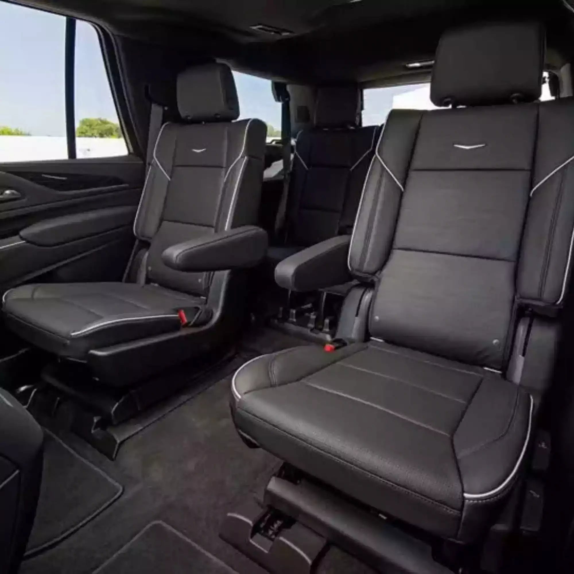 Black leather interior of a vehicle with visible brand logo.