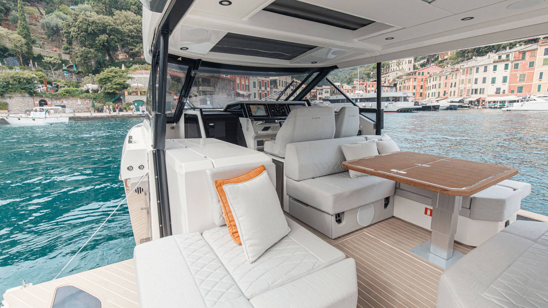 Interior of a luxury yacht with a waterfront view