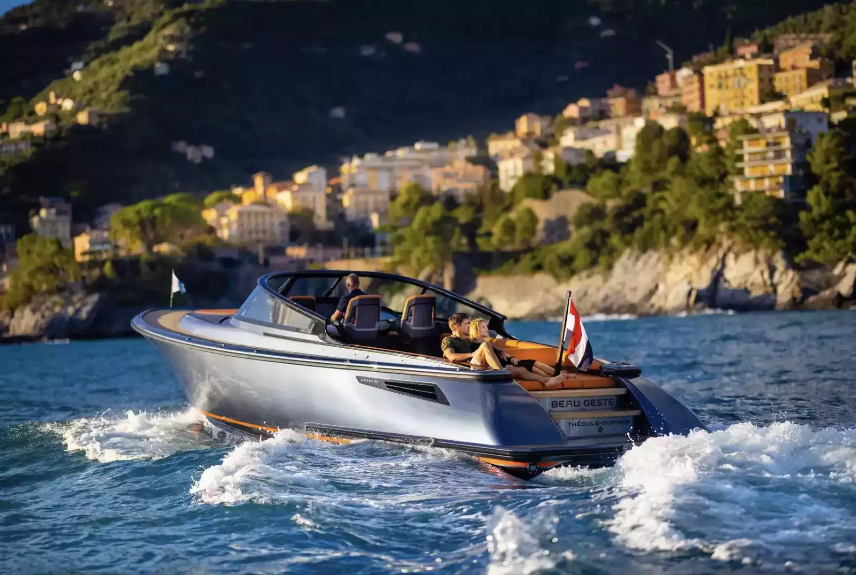 Speedboat on the water with a scenic coastal background